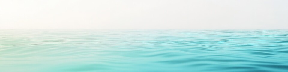 Horizon over calm sea with gradient blue to white