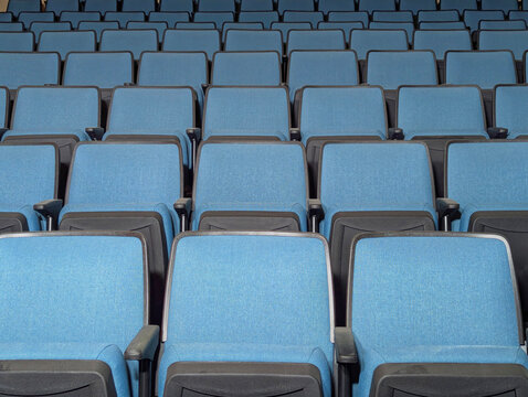 Generated iEmpty Rows of Modern Blue Auditorium Seats in an empty Hall mage