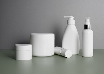 Cosmetic bottles for hair, body, and face care on gray background