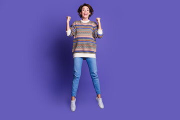 Photo of cheerful charming woman wear trendy clothes rejoice jackpot isolated on purple color background