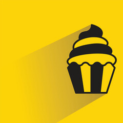 cupcake with shadow on yellow background