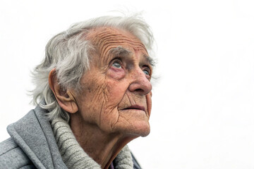 Elderly woman looking upward: contemplative expression against white background