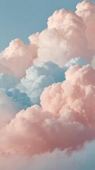 the ethereal beauty of a sky filled with soft, pastel-colored clouds. The clouds, painted in shades of pink, blue, and white, create a dreamlike and serene atmosphere. 