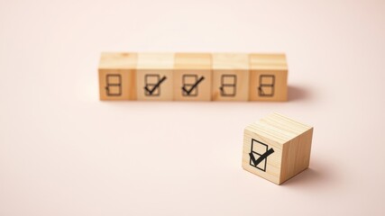 Wooden blocks with checkmarks and empty boxes signifying task completion or progress