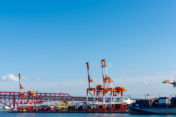 Container port and container crane at Industrial port for cargo container ship Osaka Japan....