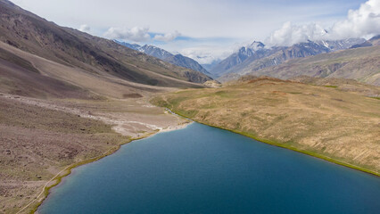 Aerial view of chandratal lake surrounded by snow-capped Himalayan mountains at chandratal in...