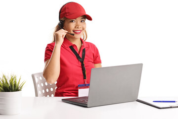 Asian female worker in a dispatch center with a laptop computer