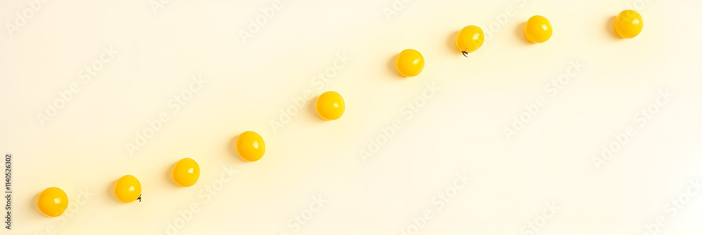 Poster Yellow cherry tomatoes are arranged in a diagonal pattern on a white background to create a minimalist design._00001_