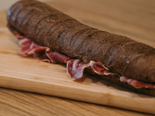 spanish ham black sandwich with orange juice