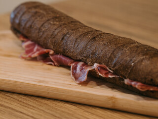 spanish ham black sandwich with orange juice