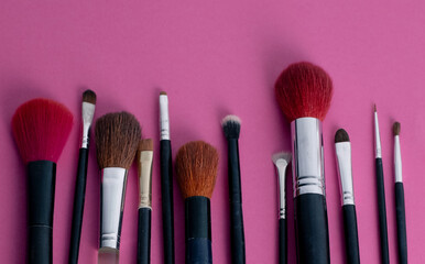 Beauty tools for makeup application on pink