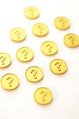 Fototapeta premium Gold coins with question marks arranged in a pattern on a white background convey a sense of financial uncertainty and risk._00003_