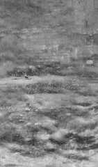 Gray concrete wall showing signs of age and weathering