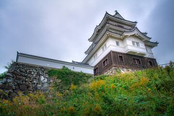 Naklejka premium Hirado Castle, or Hirado-jo, also known as Kameoka Castle, was built on top of a small, rounded mountainous peninsula facing Hirado Bay, Hirado, Nagasaki, Japan