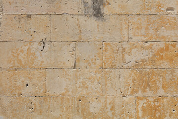 Wall of white travertine adarce stone bricks
