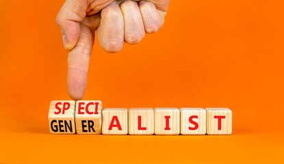 Specialist or globalist symbol. Concept words Specialist Globalist on beautiful wooden blocks. Beautiful orange background. Doctor hand. Business specialist or globalist concept. Copy space