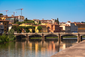 Fototapeta premium Panoramic view of river and bridge in Florence city, Italy