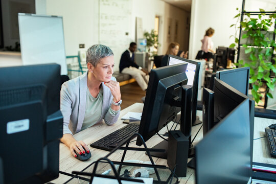 Focused businesswoman working on office computer
