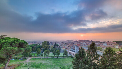 Fototapeta premium Old houses and trees during sunset in beautiful town of Albano Laziale timelapse, Italy