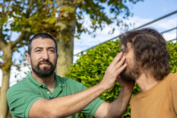 Connection and support between friends in a park setting