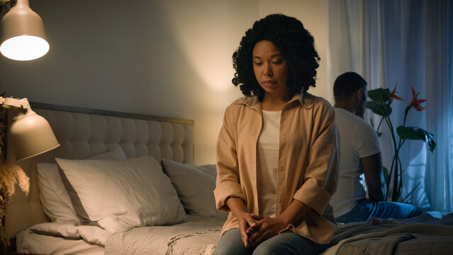 Couple family relationship problem conflict misunderstanding quarrel silence avoid separated African American woman wife girlfriend suffer sad husband boyfriend abuse frustrated sitting on bed night