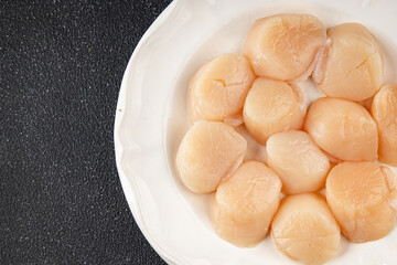 Raw sea scallop seafood fresh tasty food dish delicious gourmet food background on the table rustic food top view copy space keto and paleo diet vegetarian  food pescetarian diet