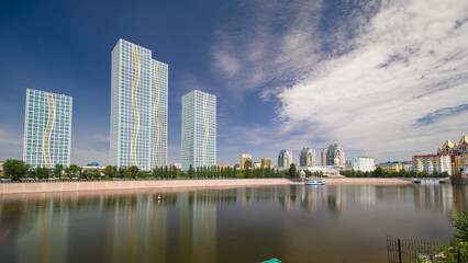 Ishim River with modern towers of residential complex timelapse hyperlapse in Astana
