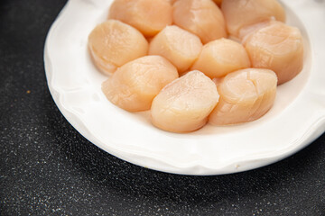 Raw sea scallop seafood fresh tasty food dish delicious gourmet food background on the table rustic food top view copy space keto and paleo diet vegetarian  food pescetarian diet