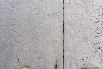 Obraz premium A wall with a lot of holes and cracks