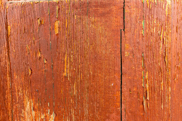 Fototapeta premium The image is of a wooden surface with a lot of rust and paint peeling off
