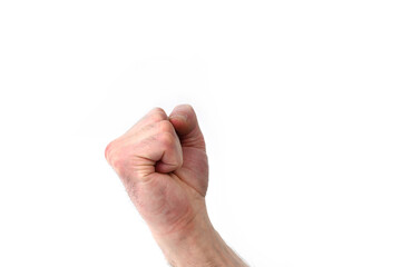 An isolated male fist symbolizing a threat and a willingness to fulfill it