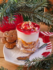 Berry desserts on wooden background. New Year