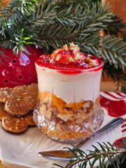 Berry desserts on wooden background. New Year