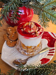 Berry desserts on wooden background. New Year