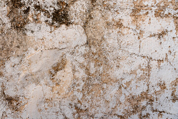 A wall with a lot of dirt and grime on it