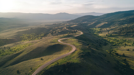 Serene winding mountain road at sunrise feeling of peace and adventure