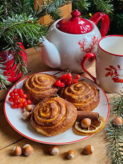 Cinnamon buns with tea. New Year