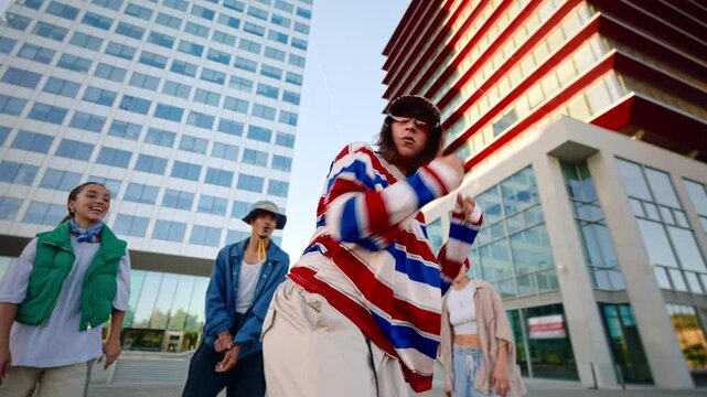 Trendy woman together with dynamic group of dancers expressing urban energy in of modern city