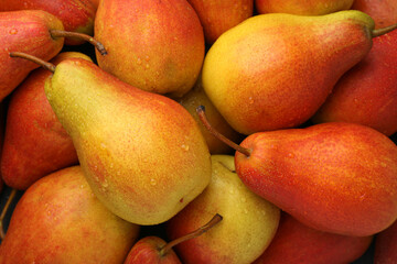 Fresh ripe juicy pears as background, closeup