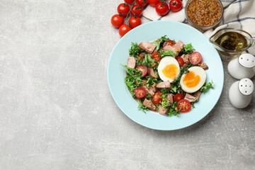 Delicious fresh tuna salad and ingredients on grey textured table, flat lay. Space for text