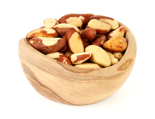 Tasty Brazil nuts in bowl isolated on white