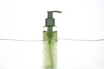A bottle of cosmetic product in water.