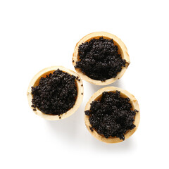 Waffle bowls with delicious black caviar on white background