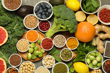 Superfood. Different healthy food products on grey table, flat lay