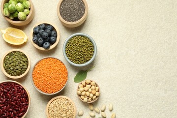 Different superfood products on light table, flat lay. Space for text
