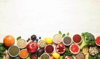 Different superfood products on white table, flat lay. Space for text