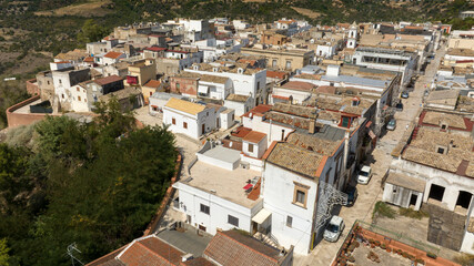 Fototapeta premium Aerial view of houses, apartments and buildings located in the historic center of the town of Bernalda, in the province of Matera, Basilicata, Italy. It is a traditional Italian village.