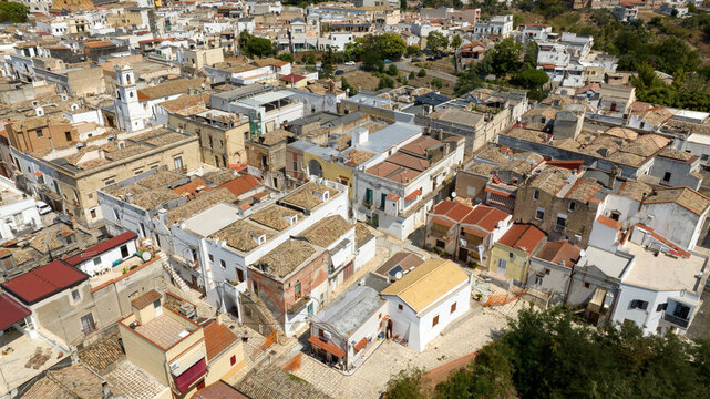 Aerial view of houses, apartments and buildings located in the historic center of the town of Bernalda, in the province of Matera, Basilicata, Italy. It is a traditional Italian village.