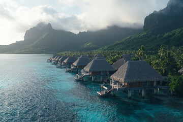 Aerial view of Bora Bora, island with lush green and clear blue water.