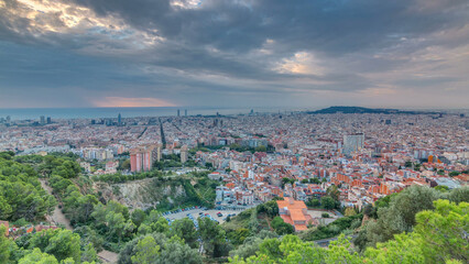 Fototapeta premium Panorama of Barcelona timelapse, Spain, viewed from the Bunkers of Carmel